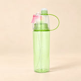 TibaToes™ MistSip Bottle in the photographed green design on a calm warm beige background.