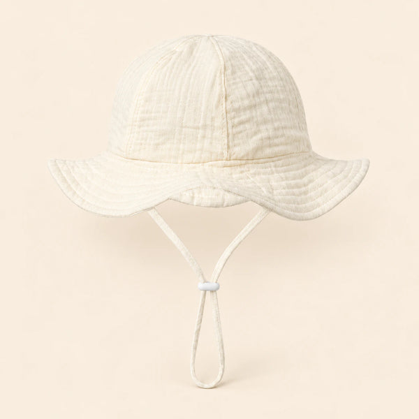 TibaToes™ CloudShade Hat, Cloud Cream option on a clean warm beige background.