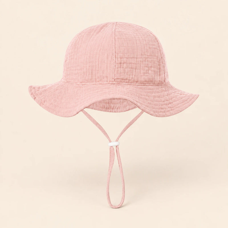 TibaToes™ CloudShade Hat, Baby pink option on a clean warm beige background.
