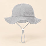 TibaToes™ CloudShade Hat, Pebble Grey option on a clean warm beige background.