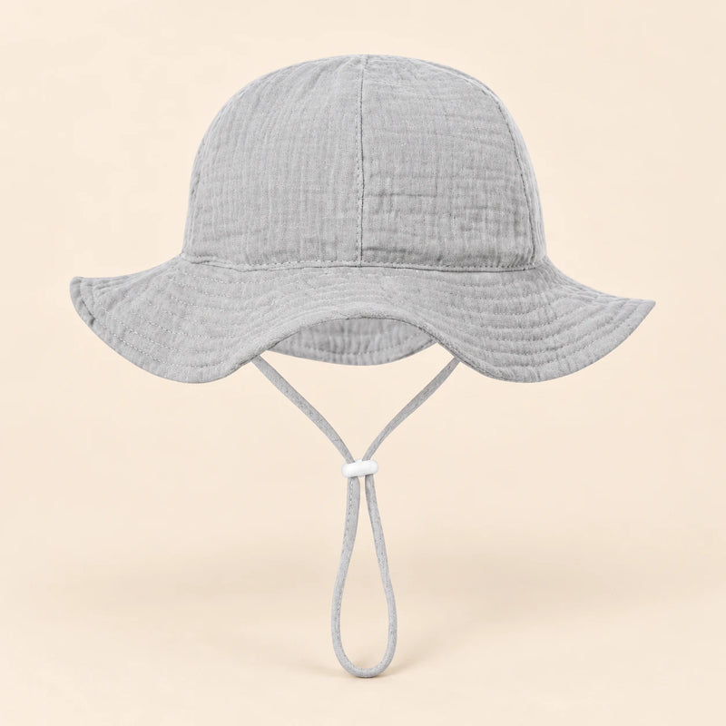 TibaToes™ CloudShade Hat, Pebble Grey option on a clean warm beige background.