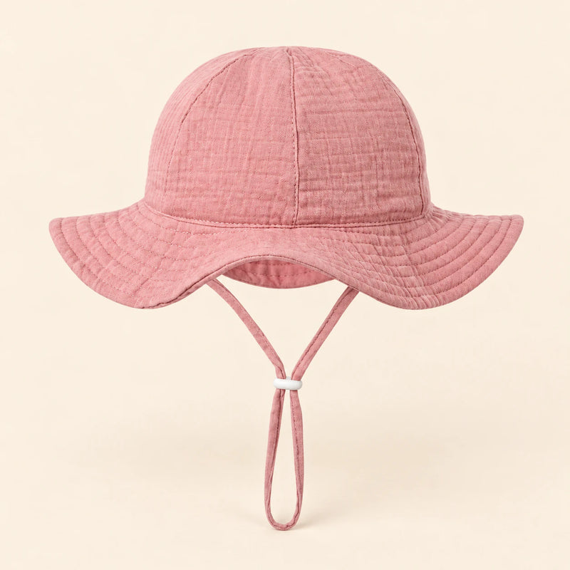 TibaToes™ CloudShade Hat, Coral Bloom option on a clean warm beige background.