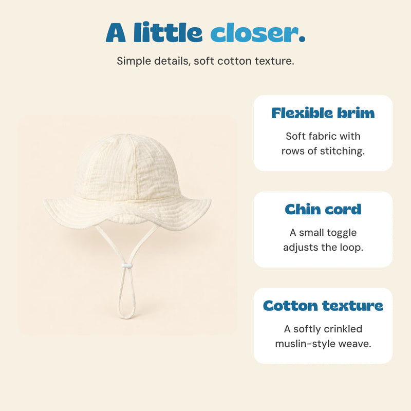 Cream CloudShade hat with descriptions of its flexible stitched brim, adjustable cord and cotton texture.