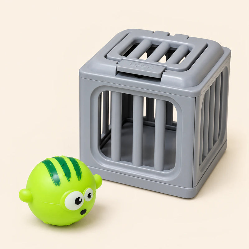 One lime-green striped puffer toy beside one gray rescue cage on a warm beige background. This is one separate variant choice.