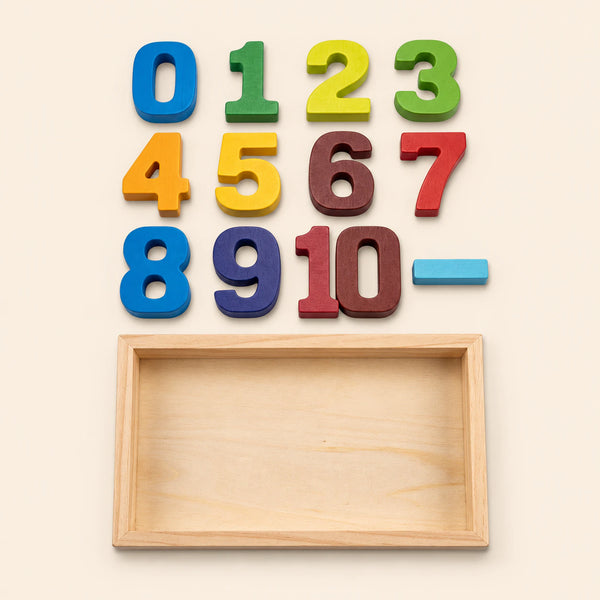 Colourful wooden number blocks and an empty wooden tray on warm beige.