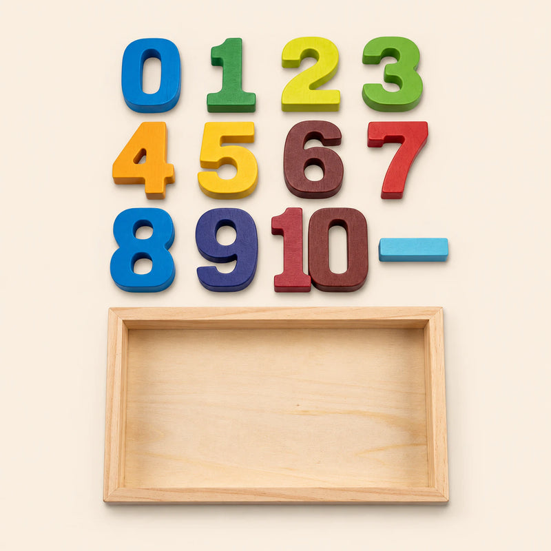 Colourful wooden number blocks and an empty wooden tray on warm beige.