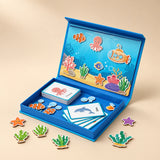 A blue magnetic puzzle book with underwater scene pieces and sea-animal cards on a sunlit table.