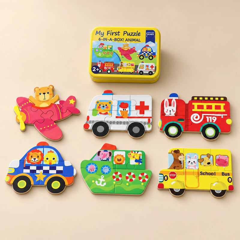 A storage tin and six assembled puzzles showing airplane, ambulance, fire engine, police car, boat and bus on a sunlit beige table.