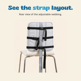Rear view of the source white chair with the three original black horizontal straps, buckles and grey centre strip.
