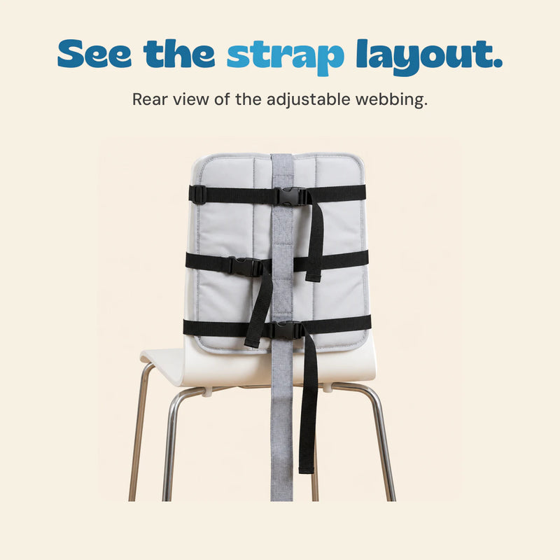 Rear view of the source white chair with the three original black horizontal straps, buckles and grey centre strip.
