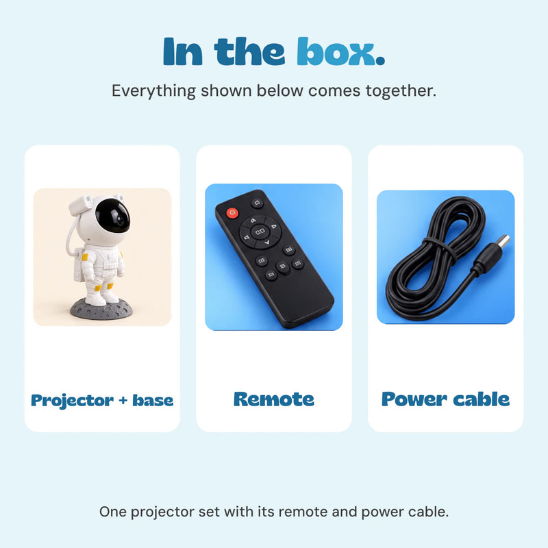 Included items are the astronaut projector with lunar base, a black remote control and a black power cable.