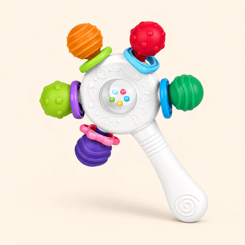 Soft White Rattle with five colourful textured ends and a long handle, alone on warm beige.