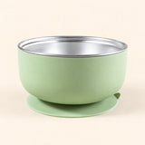 Sage Bear Bowl with a stainless steel interior and round suction base, shown empty on warm beige.