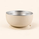 Oat Bear Bowl with a stainless steel interior and round suction base, shown empty on warm beige.