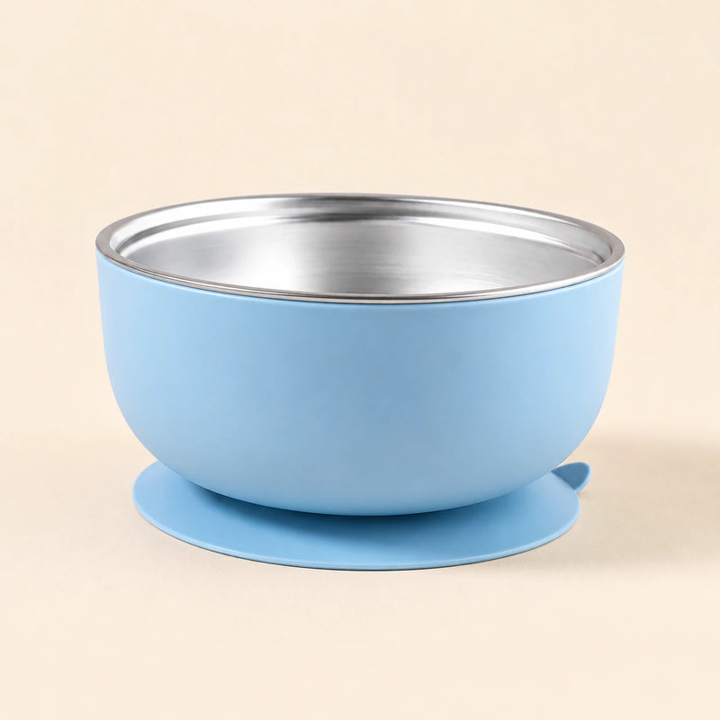 Sky Bear Bowl with a stainless steel interior and round suction base, shown empty on warm beige.