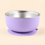 Lilac Bear Bowl with a stainless steel interior and round suction base, shown empty on warm beige.