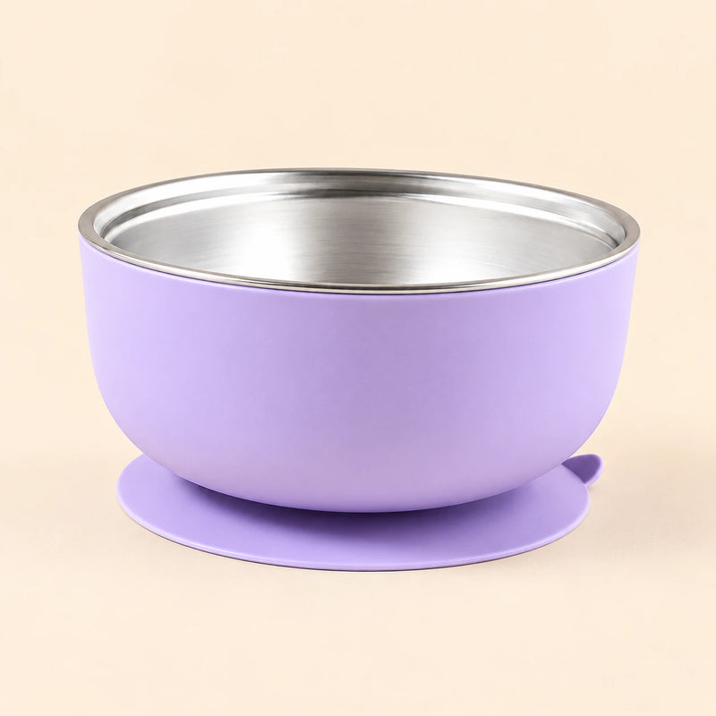 Lilac Bear Bowl with a stainless steel interior and round suction base, shown empty on warm beige.