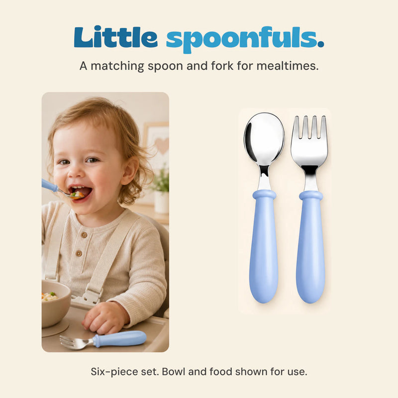 Original photograph of a child eating with the blue-handled spoon, beside the matching blue spoon and fork pair.