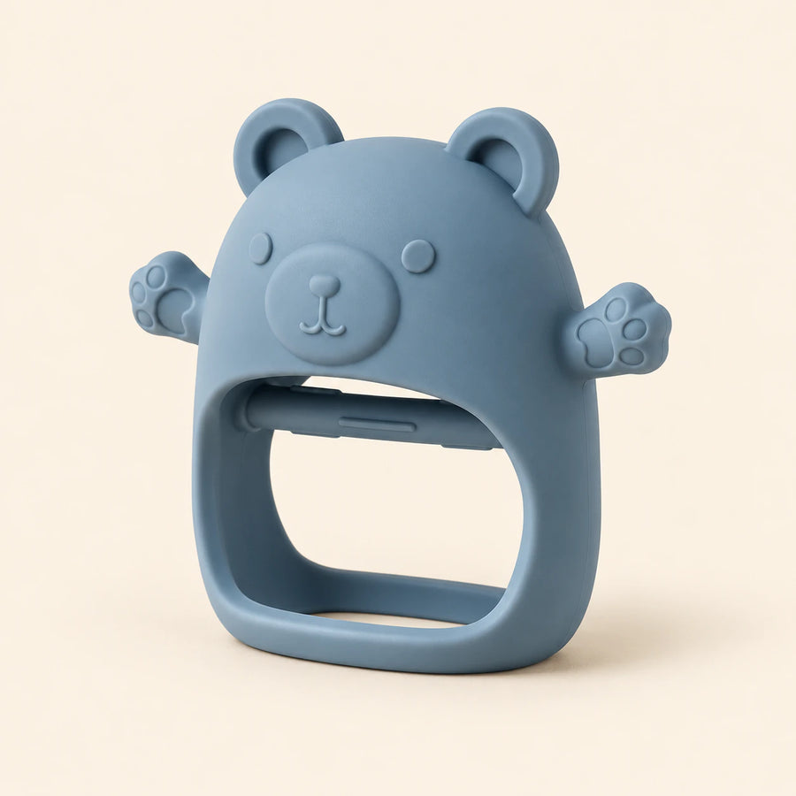 Sky Blue bear teether with raised face, rounded ears, side paws and open-centre grip on warm beige.