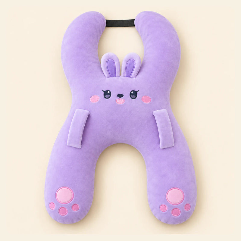 Lavender Bunny travel pillow with its original face, wraparound shape, front loops and upper strap on warm beige.
