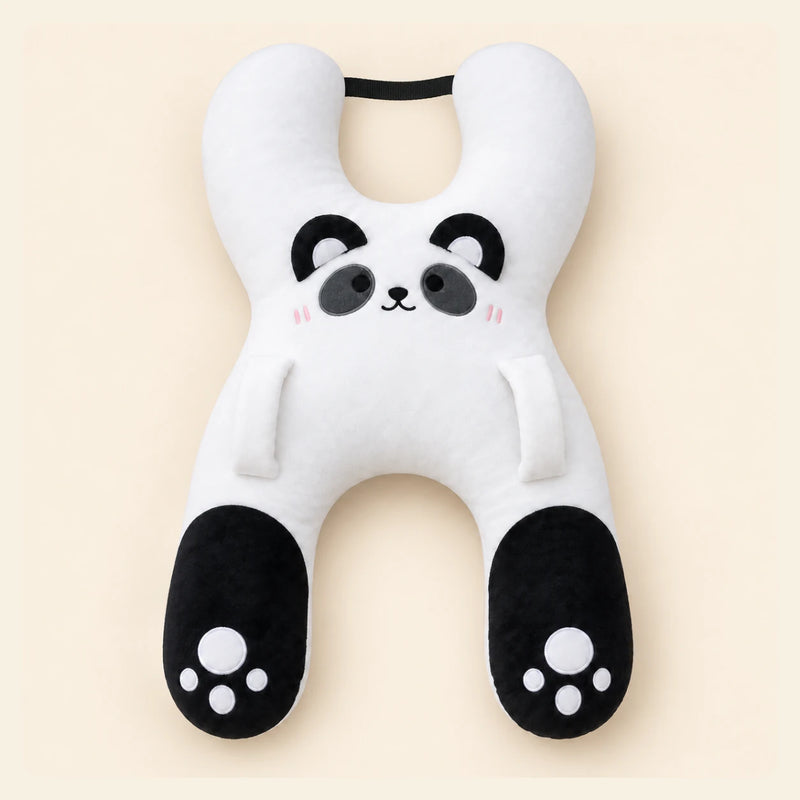 White Panda travel pillow with its original face, wraparound shape, front loops and upper strap on warm beige.