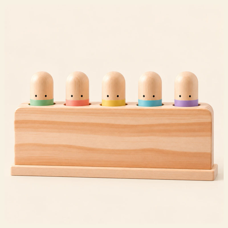Pastel Press Toy shown clearly on a smooth warm beige background.
