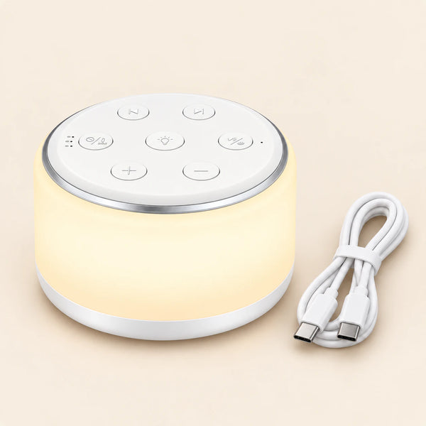 SleepyGlow White Noise Machine and its included USB cable on a smooth warm beige background.