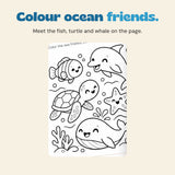 Colour ocean friends. Meet the fish, turtle and whale on the page. Original printed artwork shown in close-up.