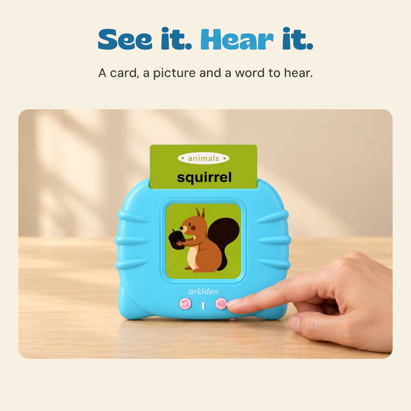 An adult index finger touches the volume button on the blue talking flashcard reader with its original squirrel card inserted.