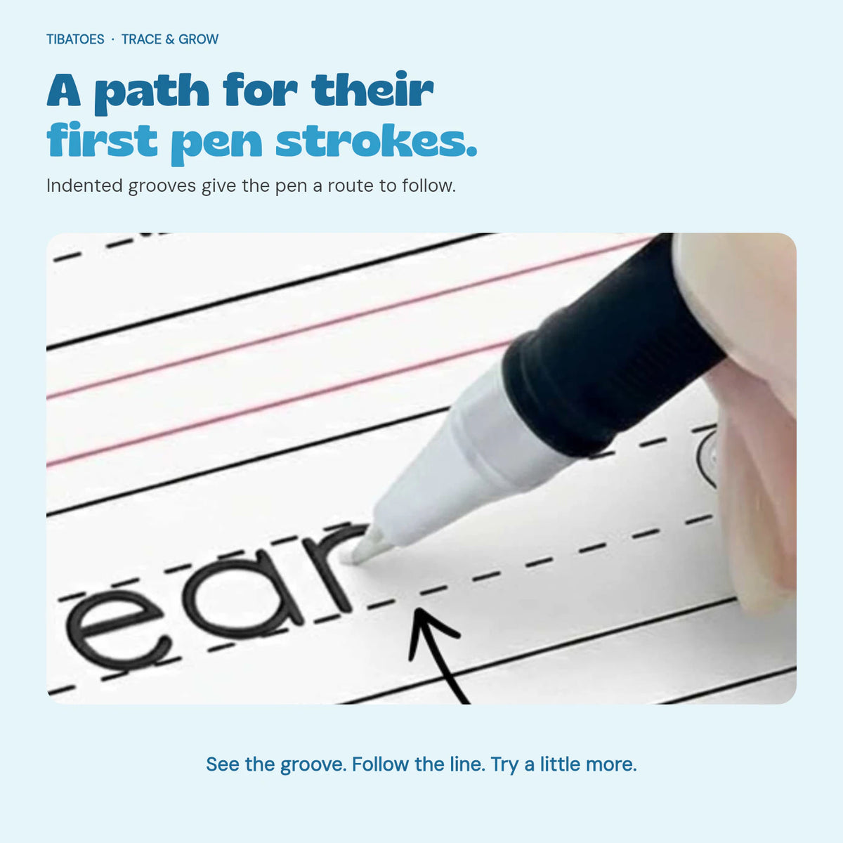 Close-up of a pen following the indented letter grooves in a writing workbook.