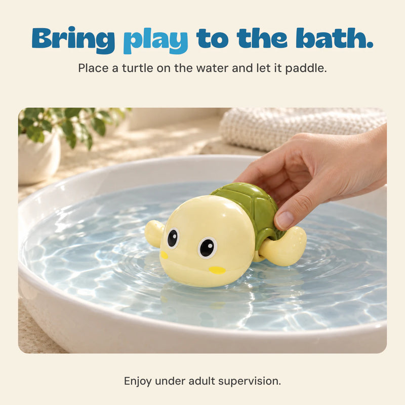 A hand places a cream and green turtle toy onto the water.