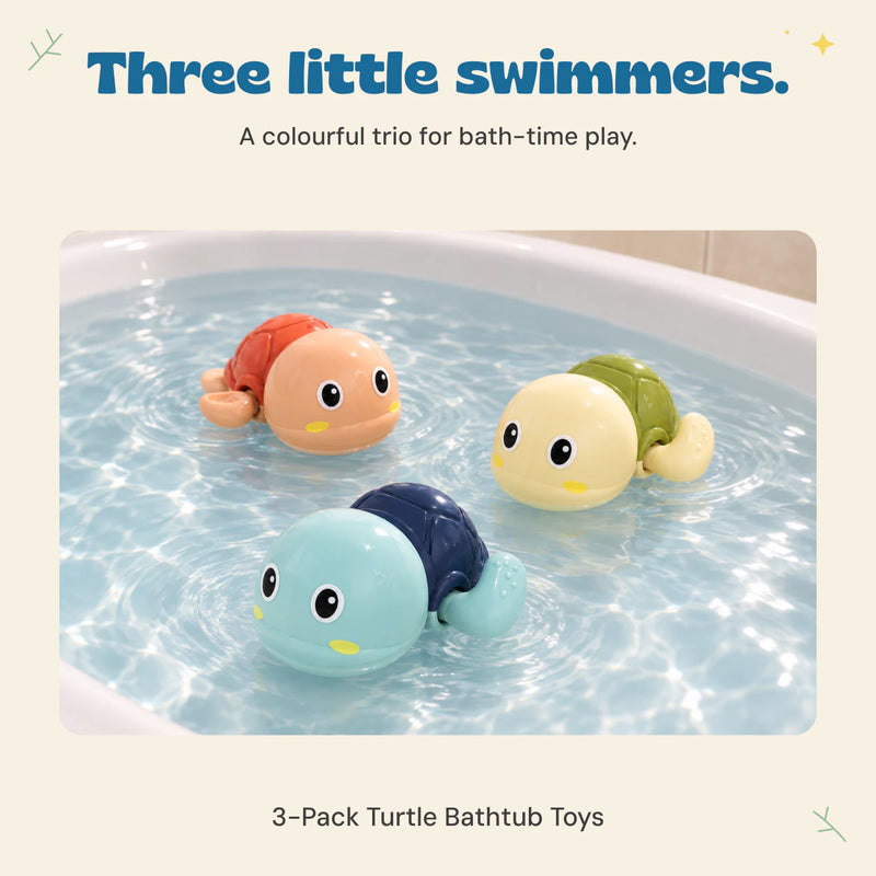 Three plastic wind-up turtles float in shallow bath water.