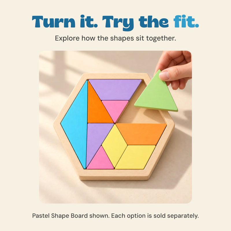 A hand lifts the pale green triangle above its matching space in the Pastel Shape Board.